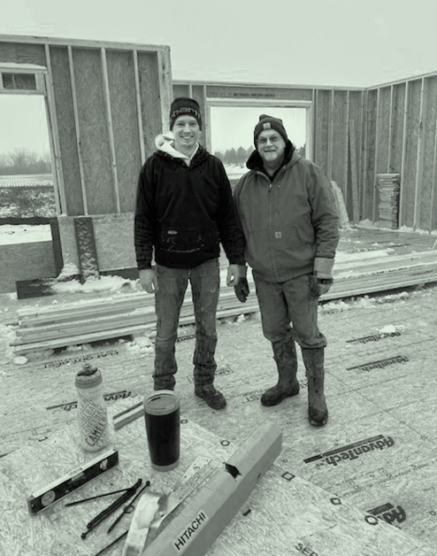 The leaders of Spiegelhoff Construction standing at the jobsite while building a new home